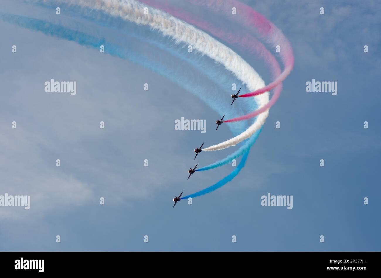 Red arrows display team flying in formation over Clacton in annual free air display Stock Photo