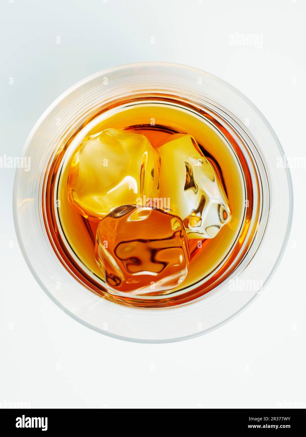 A glass of whisky with ice cubes (top view Stock Photo Alamy