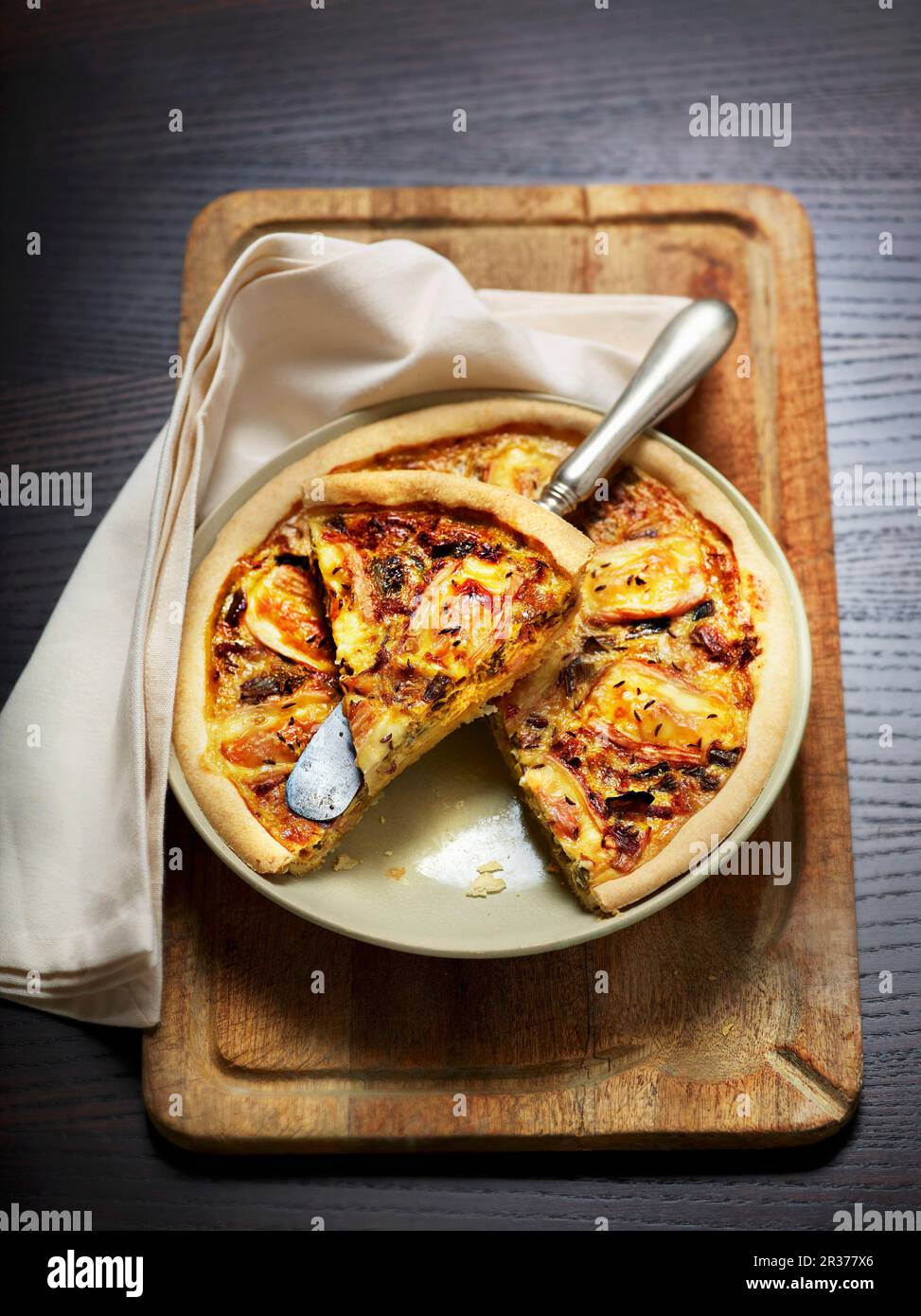 Munster cheese quiche with egg, leeks and caraway Stock Photo Alamy