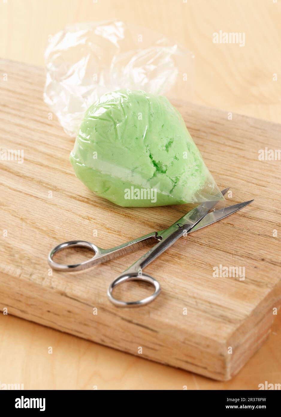 Showing how to make your own piping, or icing, bag using a plastic bag