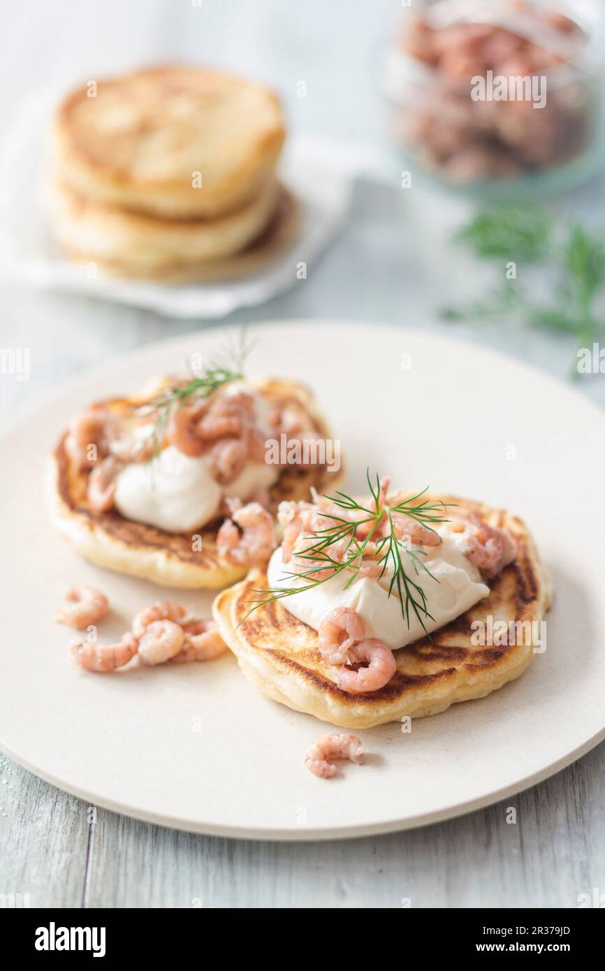 Pancakes with North Sea crab, mayonnaise and dill Stock Photo