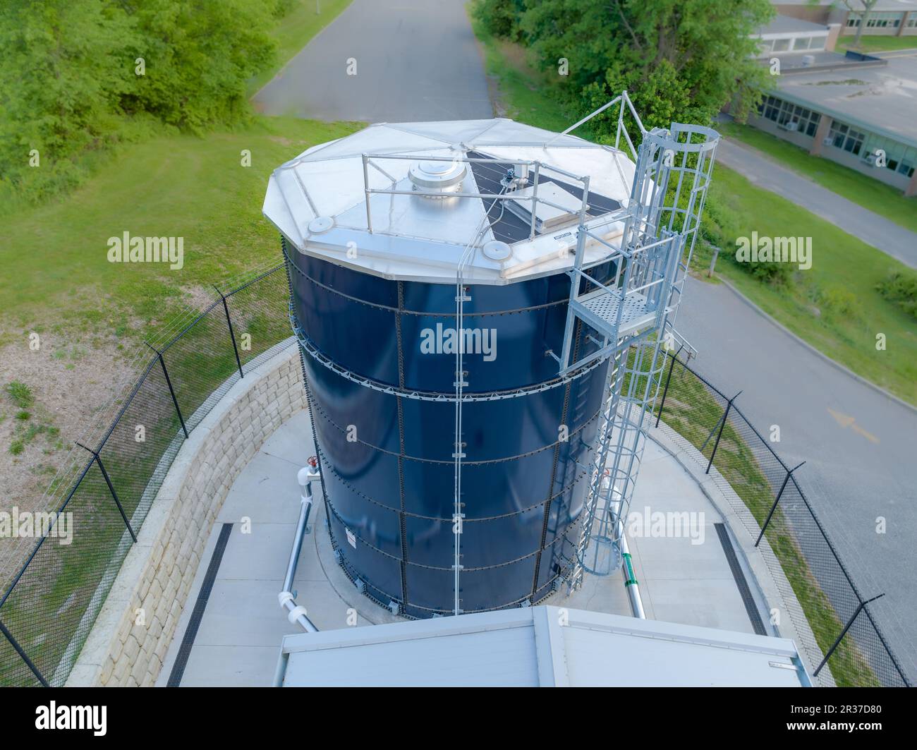 Photo of a blue steel, metal, industrial water tank, industries, commercial, municipal. Stock Photo