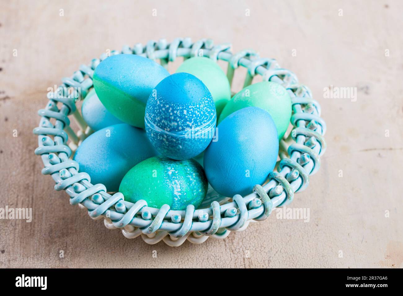 Dyed Easter eggs with batik patterns in a basket Stock Photo