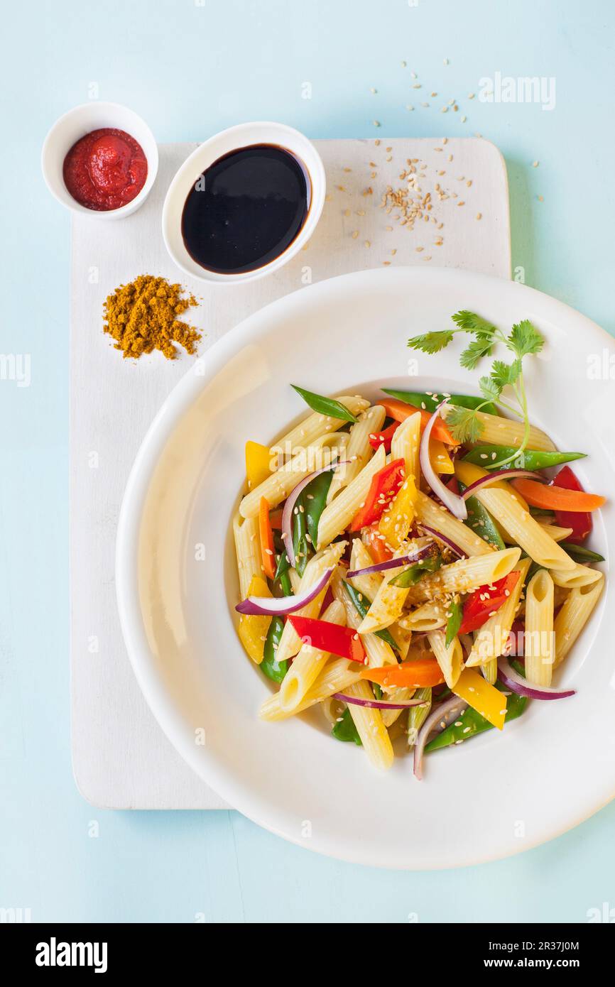 Penne with Asian-style vegetables Stock Photo - Alamy