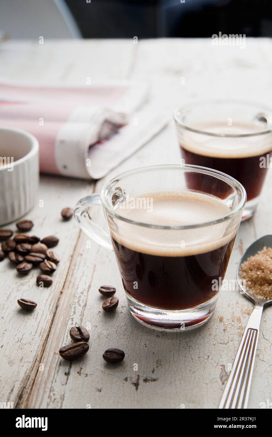 Two cups of espresso with scattered coffee beans Stock Photo Alamy