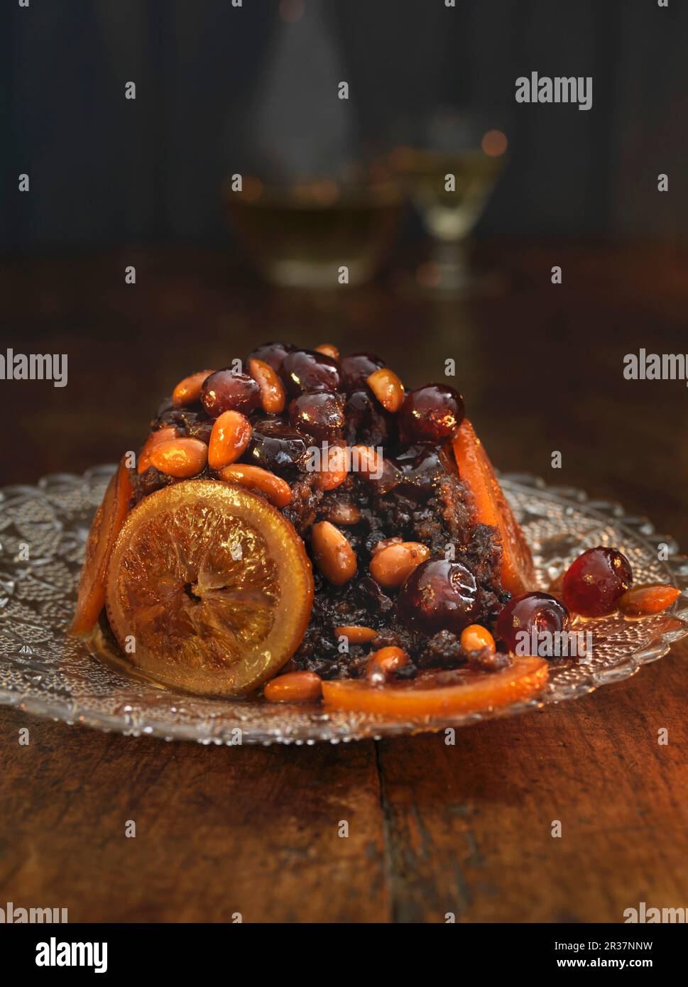 Christmas pudding with candied fruits and almonds Stock Photo