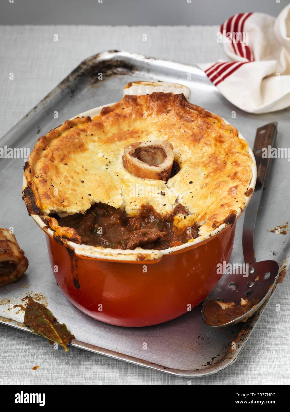 Bone marrow pie in an oven dish, with a piece missing (England Stock