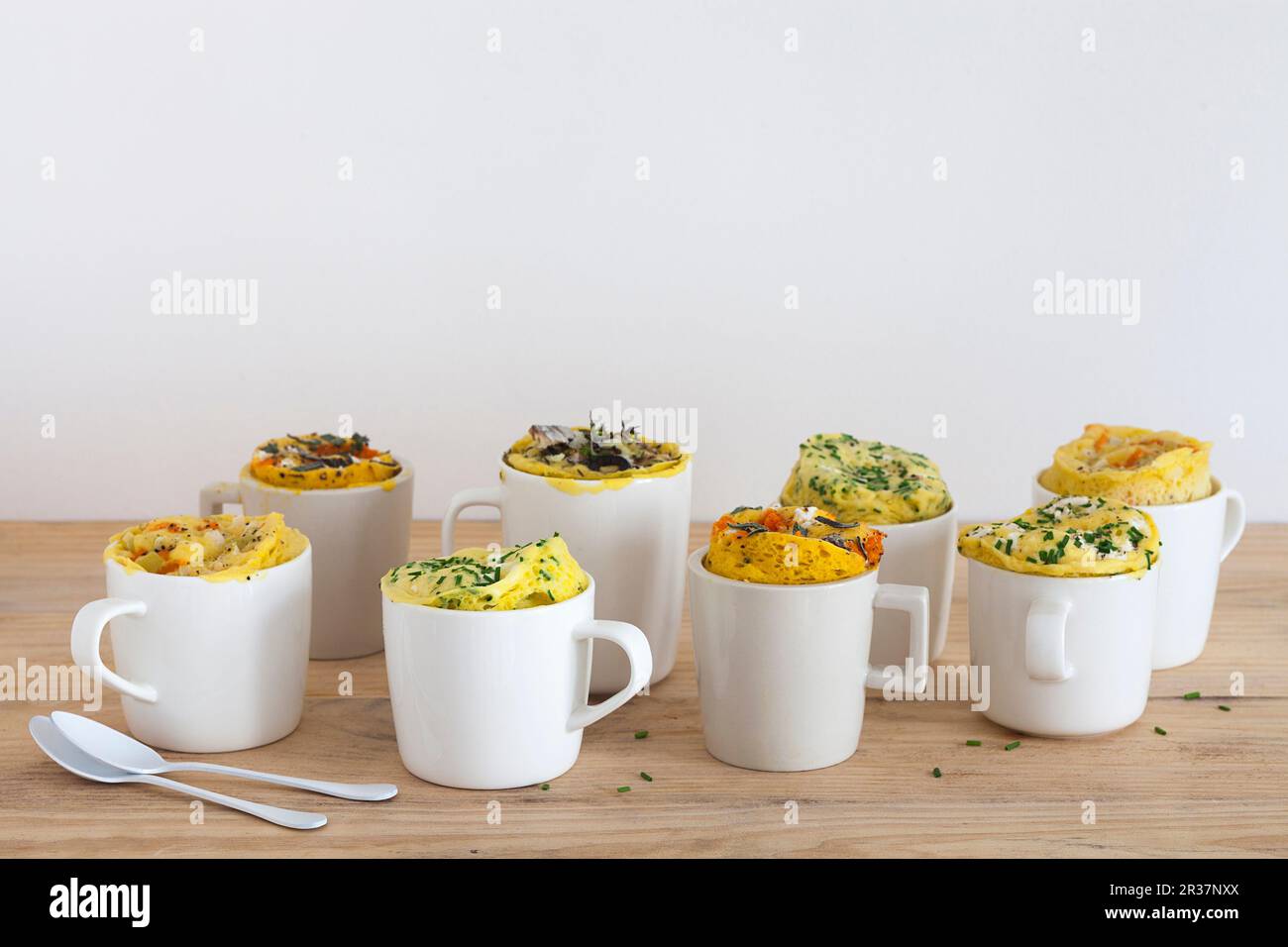 Eight different savoury mug cakes Stock Photo