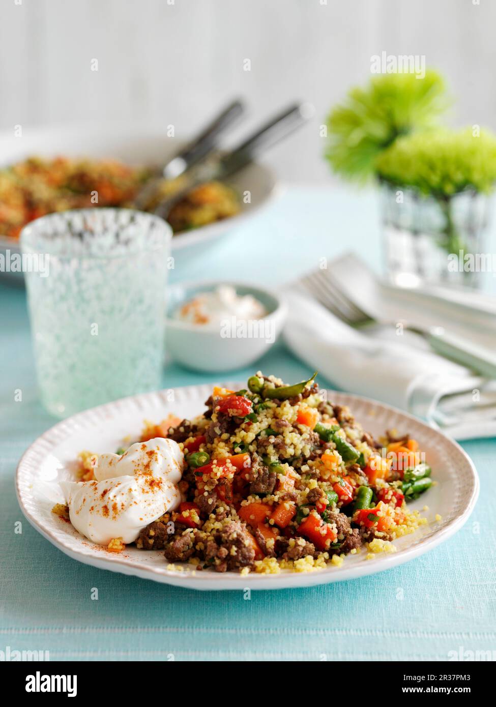 Couscous with minced beef, vegetables and yoghurt Stock Photo Alamy