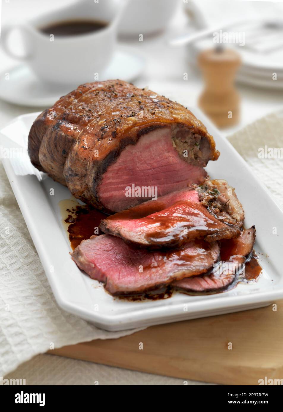 A joint of roast beef, sliced Stock Photo Alamy
