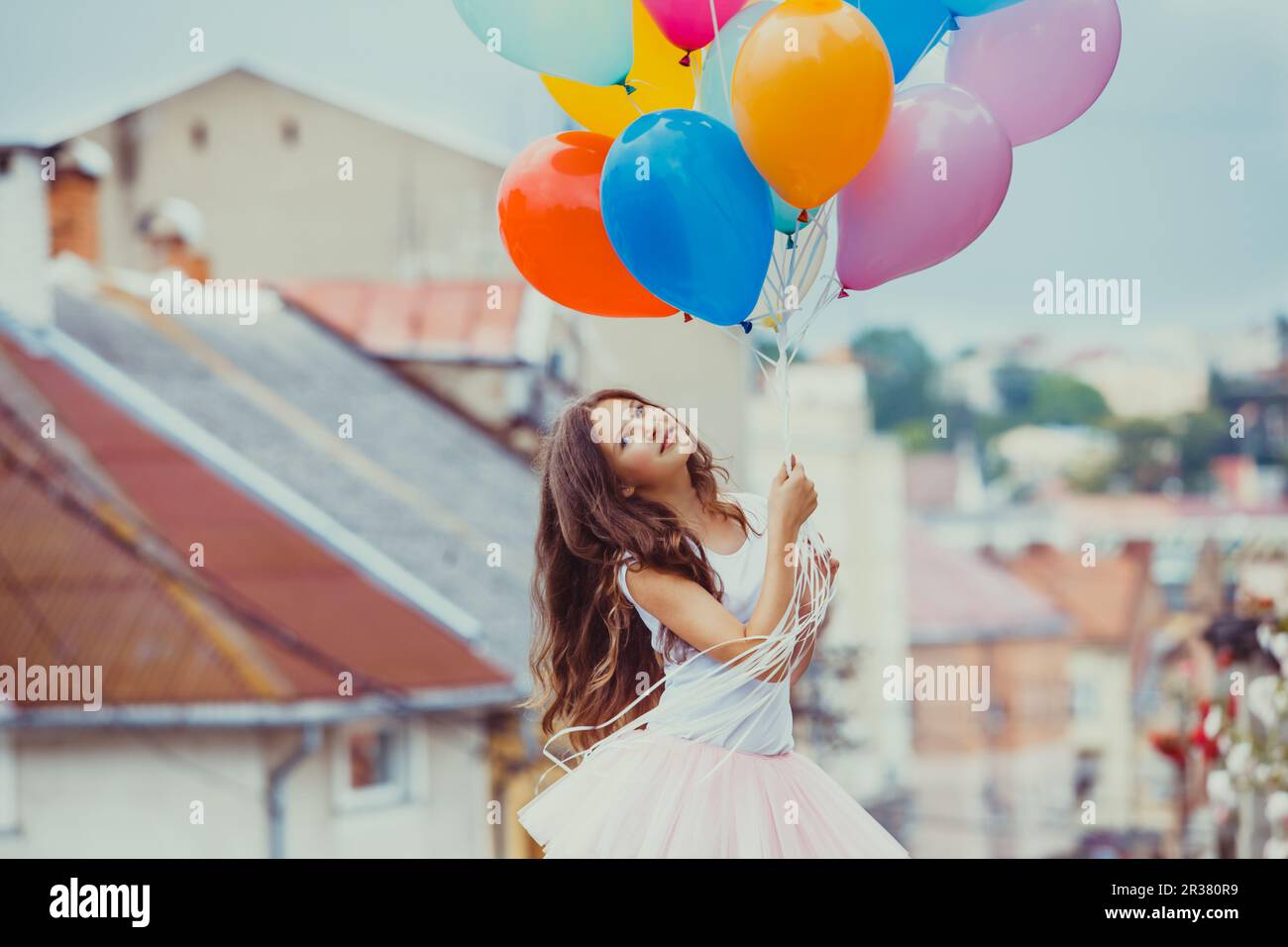 Girl with colorful latex balloons Stock Photo