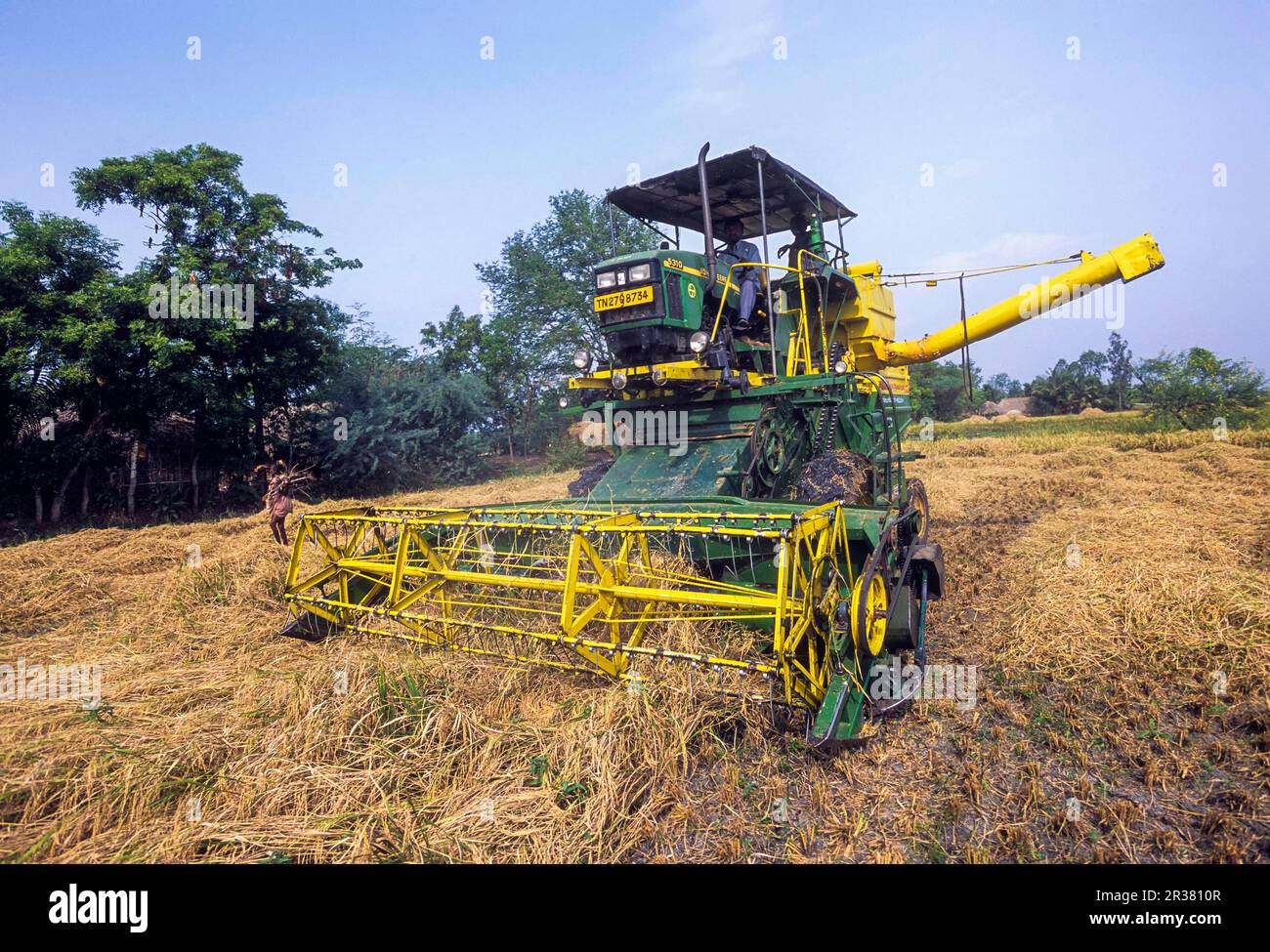Rice harvester machine in fields at Neyveli, Cuddalore, Tamil Nadu