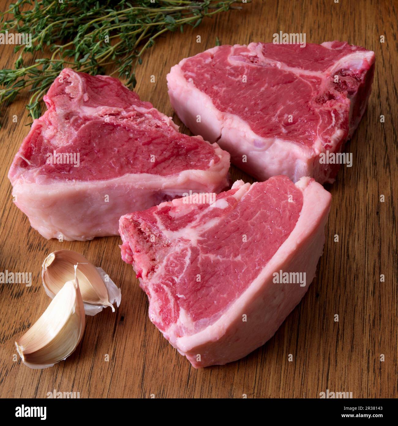 Raw lamb chops with garlic and herbs Stock Photo Alamy