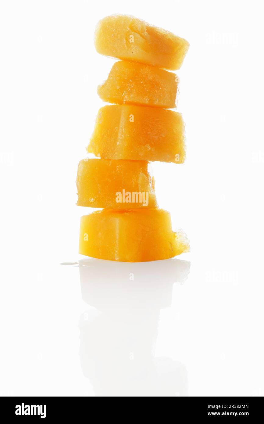 Ice cubes made from orange juice Stock Photo