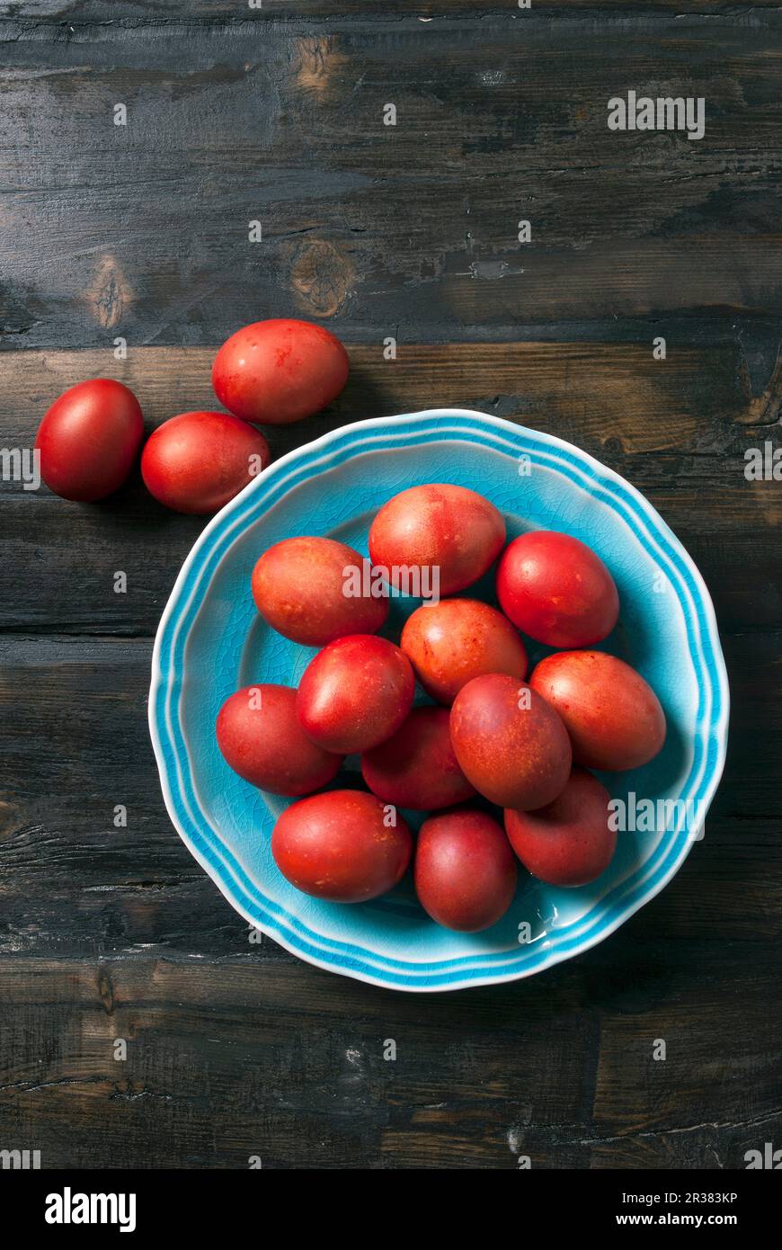Red Greek Easter eggs on a plate Stock Photo