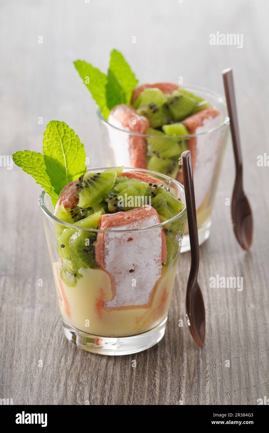 Charlottes in glasses with rose de Reims biscuits and kiwi fruit (France) Stock Photo