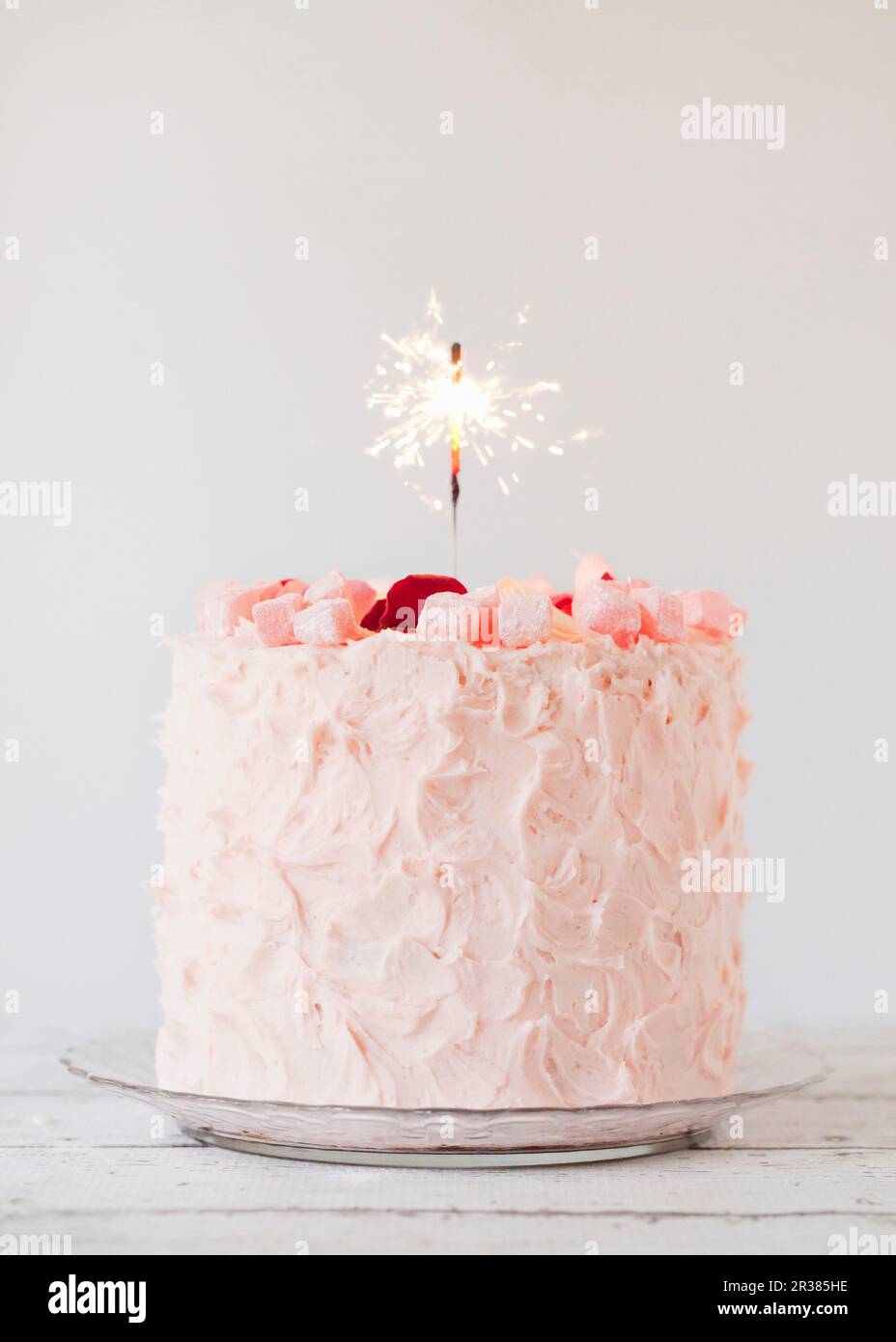 Turkish Delight layer cake with a sparkler candle Stock Photo - Alamy