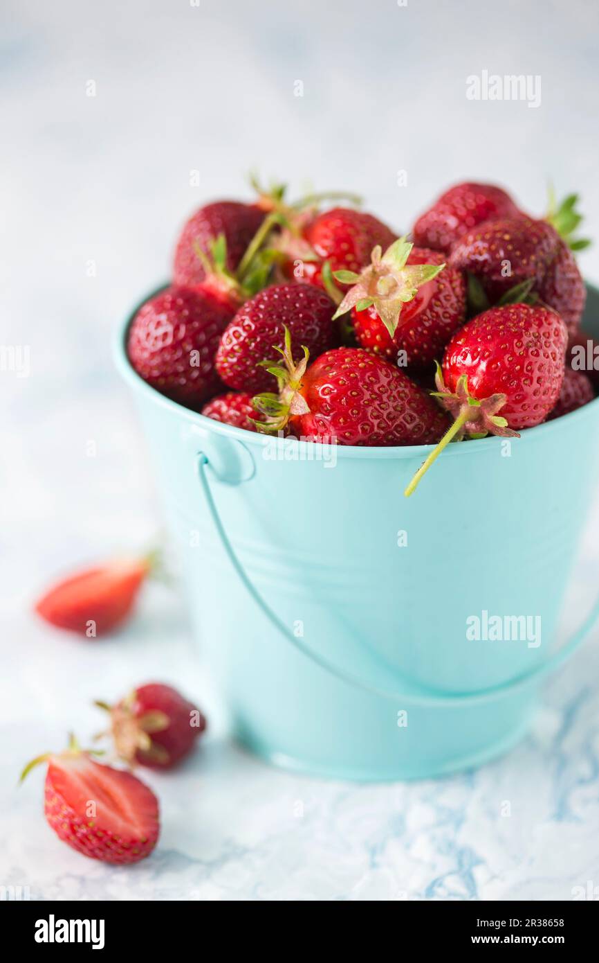 Fresh strawberries in a small metal bucket Stock Photo - Alamy