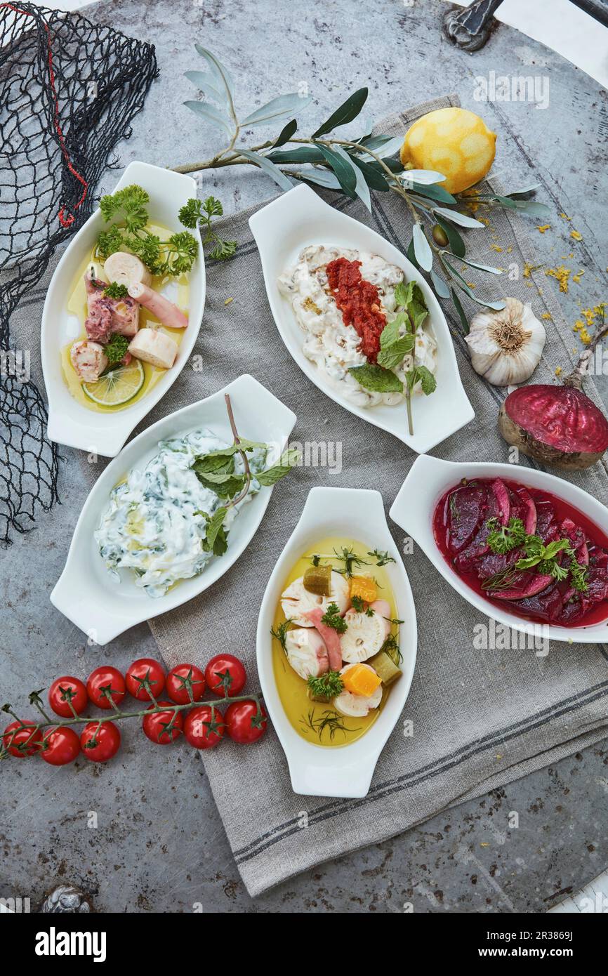Five different fish and seafood starters (top view Stock Photo Alamy