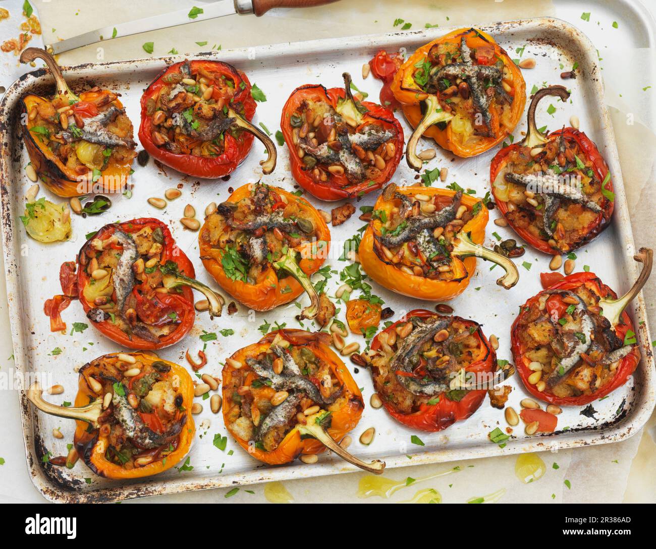 Stuffed peppers on a baking tray Stock Photo