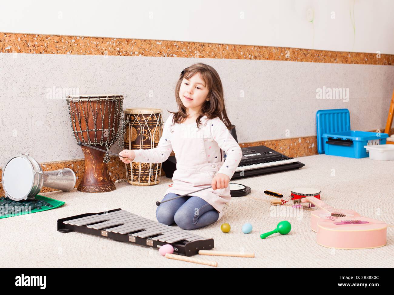 Cute girl playing on the xylophone Stock Photo