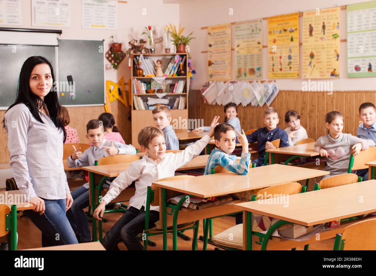 Teacher starts the lesson Stock Photo - Alamy