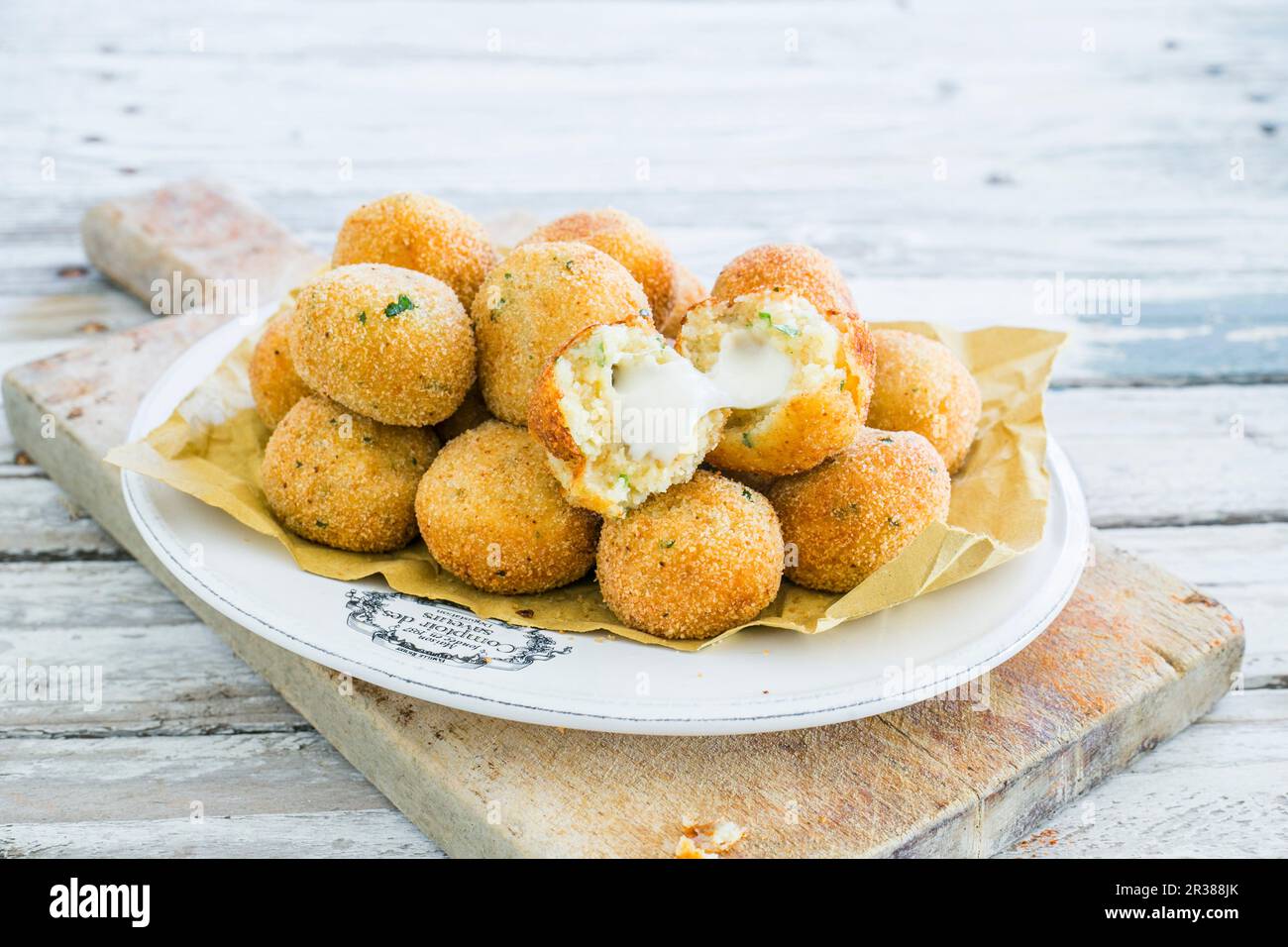 Fried potato balls with cheese centres Stock Photo Alamy