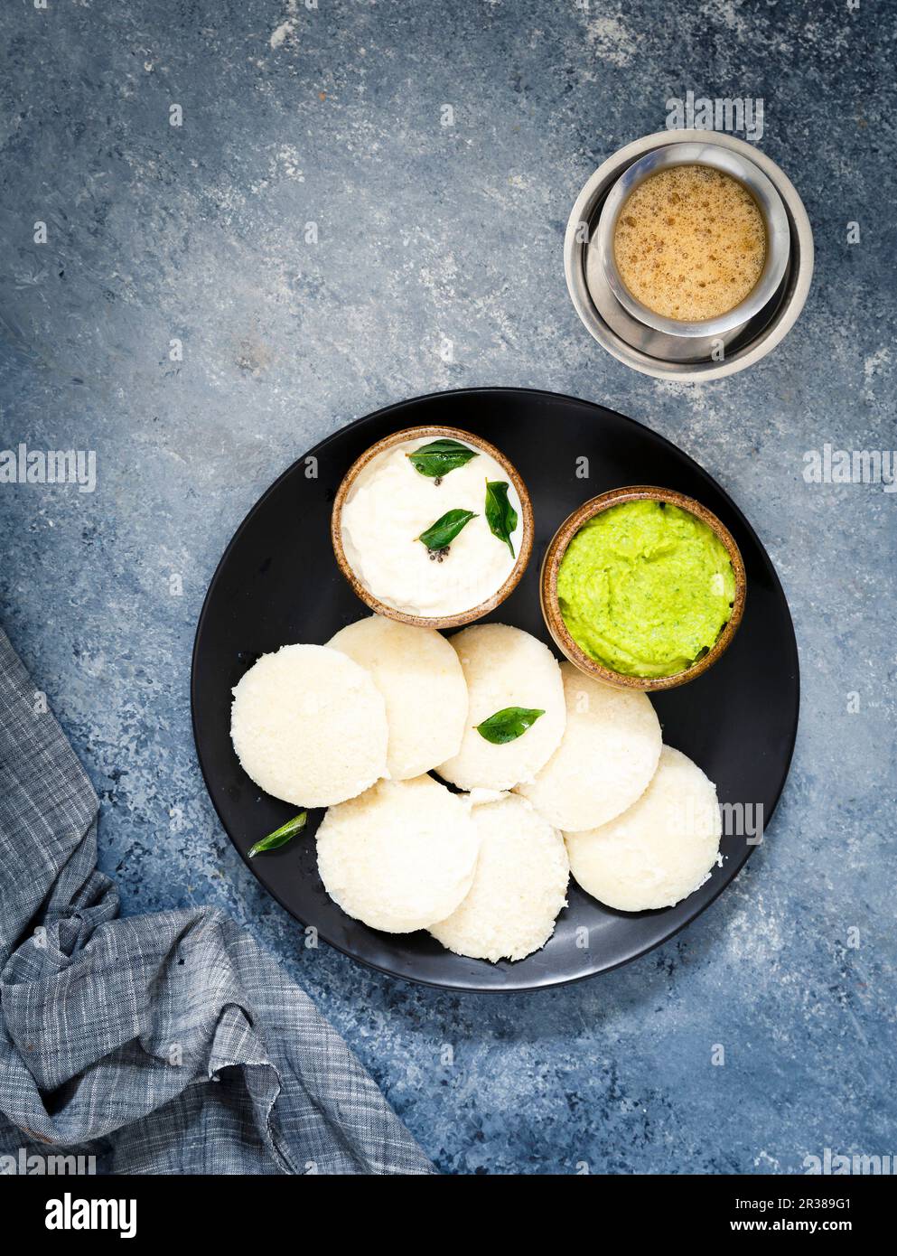 Traditional breakfast with Idli (rice cakes), coriander chutney