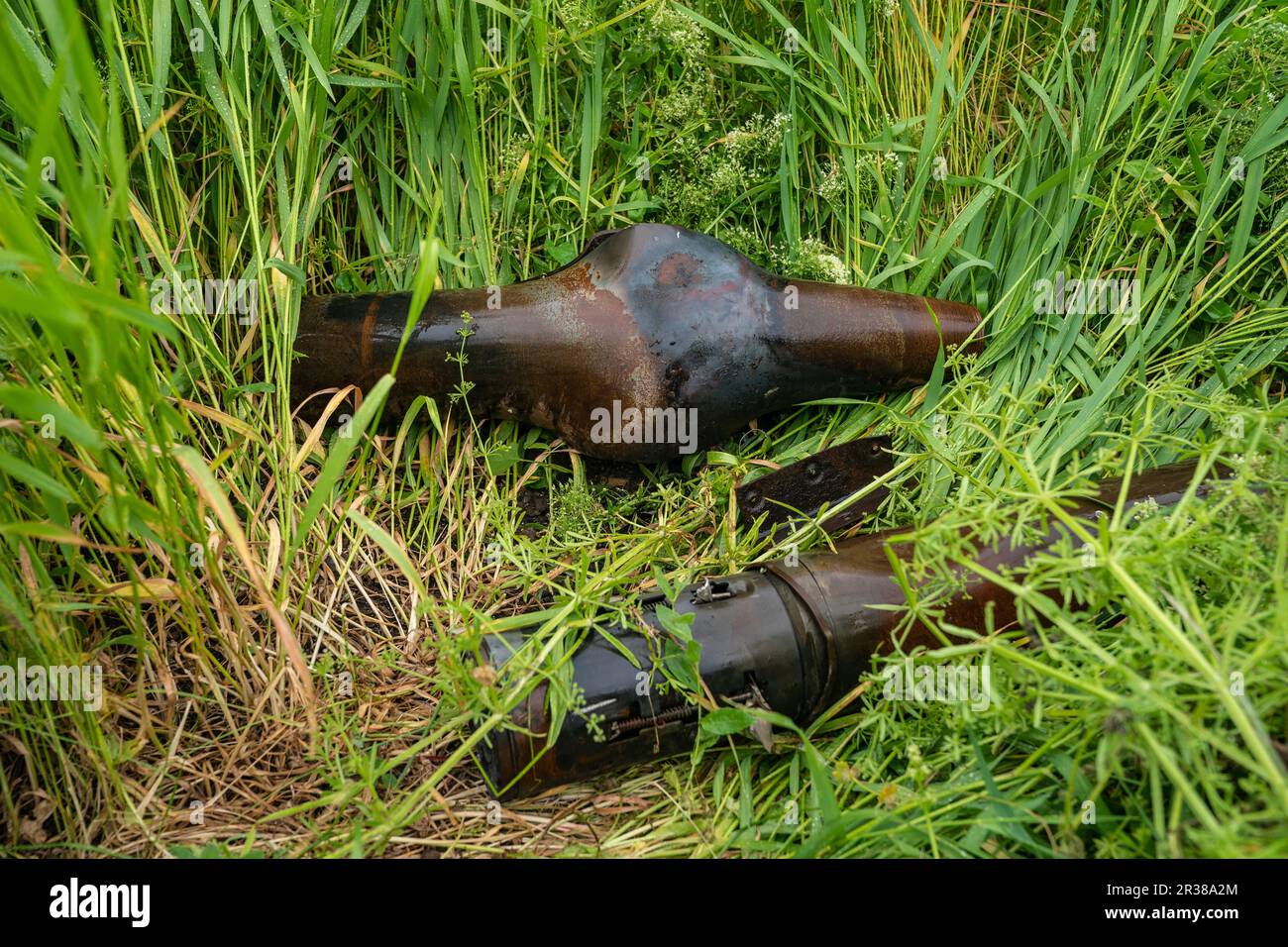 Remnants of shells and rockets used by Russian forces against Ukraine collected by de-mining unit of National Guards of Ukraine ready for scrap removal seen in near Kherson in Ukraine on May 22, 2023 Stock Photo