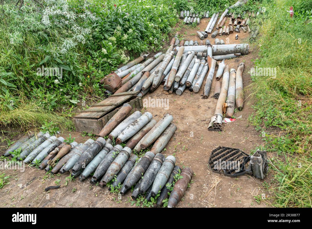Unexploded munition collected by de-mining unit of National Guards of Ukraine before they will be destroyed seen in near Kherson in Ukraine on May 22, 2023 Stock Photo
