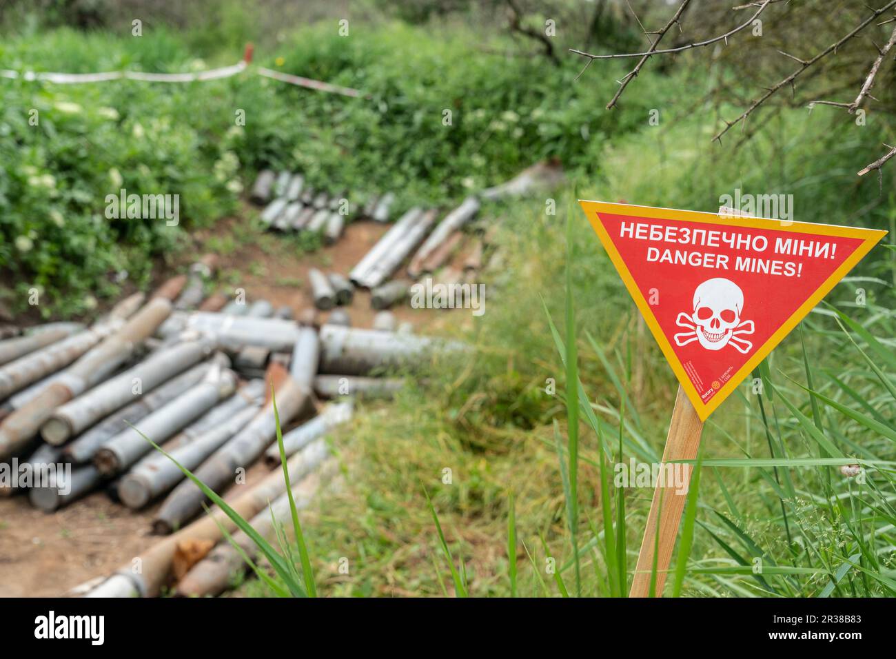 Unexploded munition collected by de-mining unit of National Guards of Ukraine before they will be destroyed seen in near Kherson in Ukraine on May 22, 2023 Stock Photo