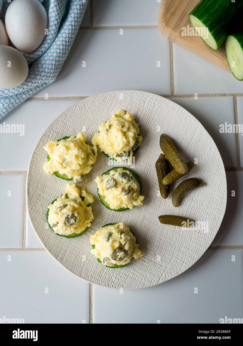 Egg salad with cornichons on cucumber Stock Photo Alamy