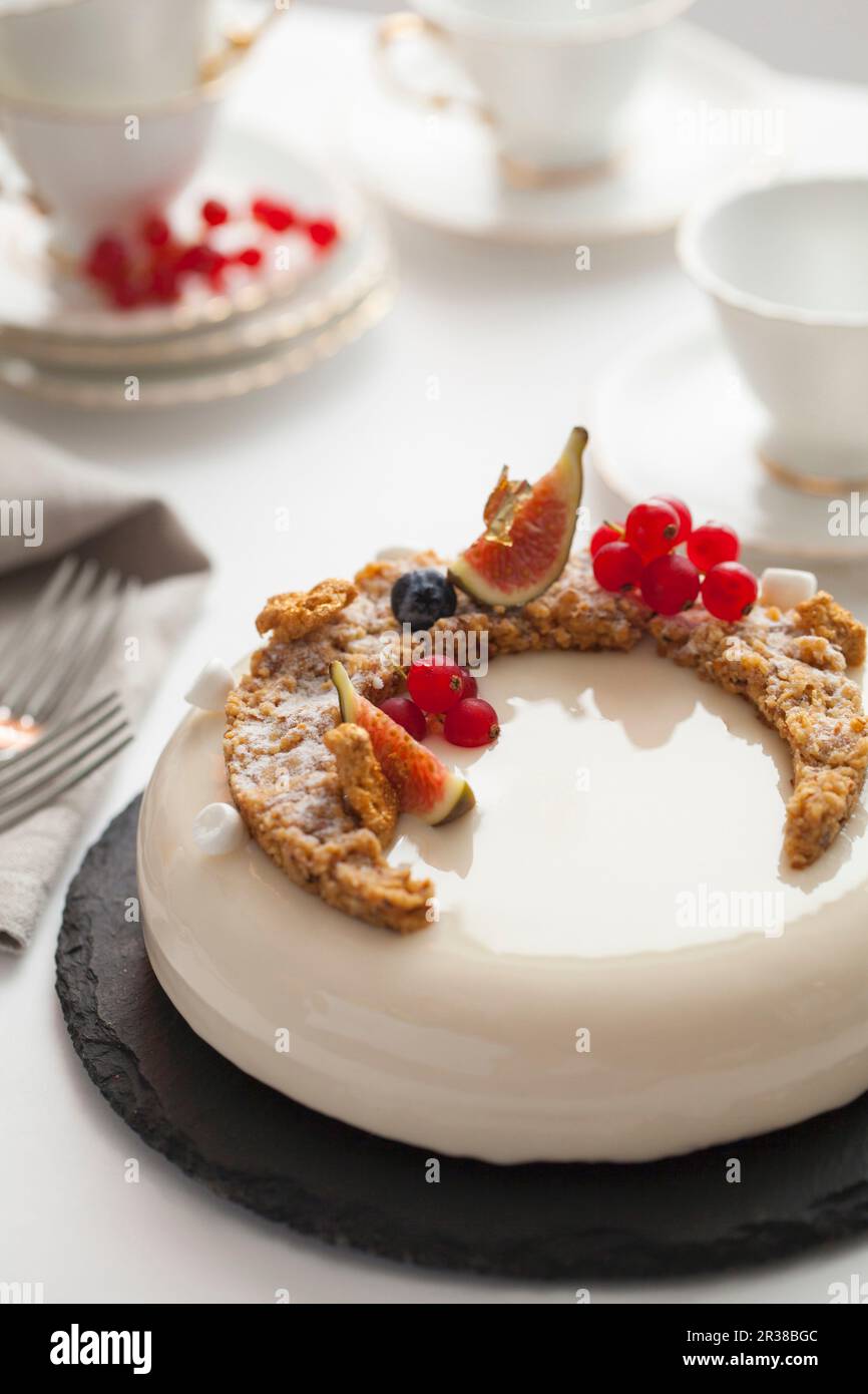 Mirror glaze cake with redcurrants and figs Stock Photo