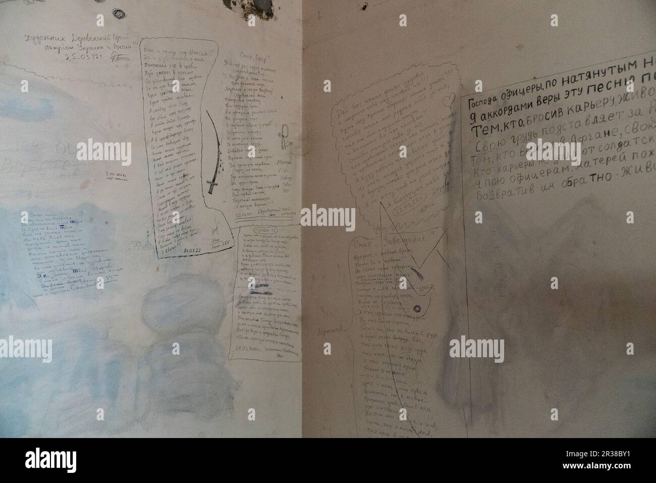 Inscriptions left on walls of cells of local police station in Kherson where Russian during occupation torture and intimidate prisoners seen on May 22, 2023 Stock Photo