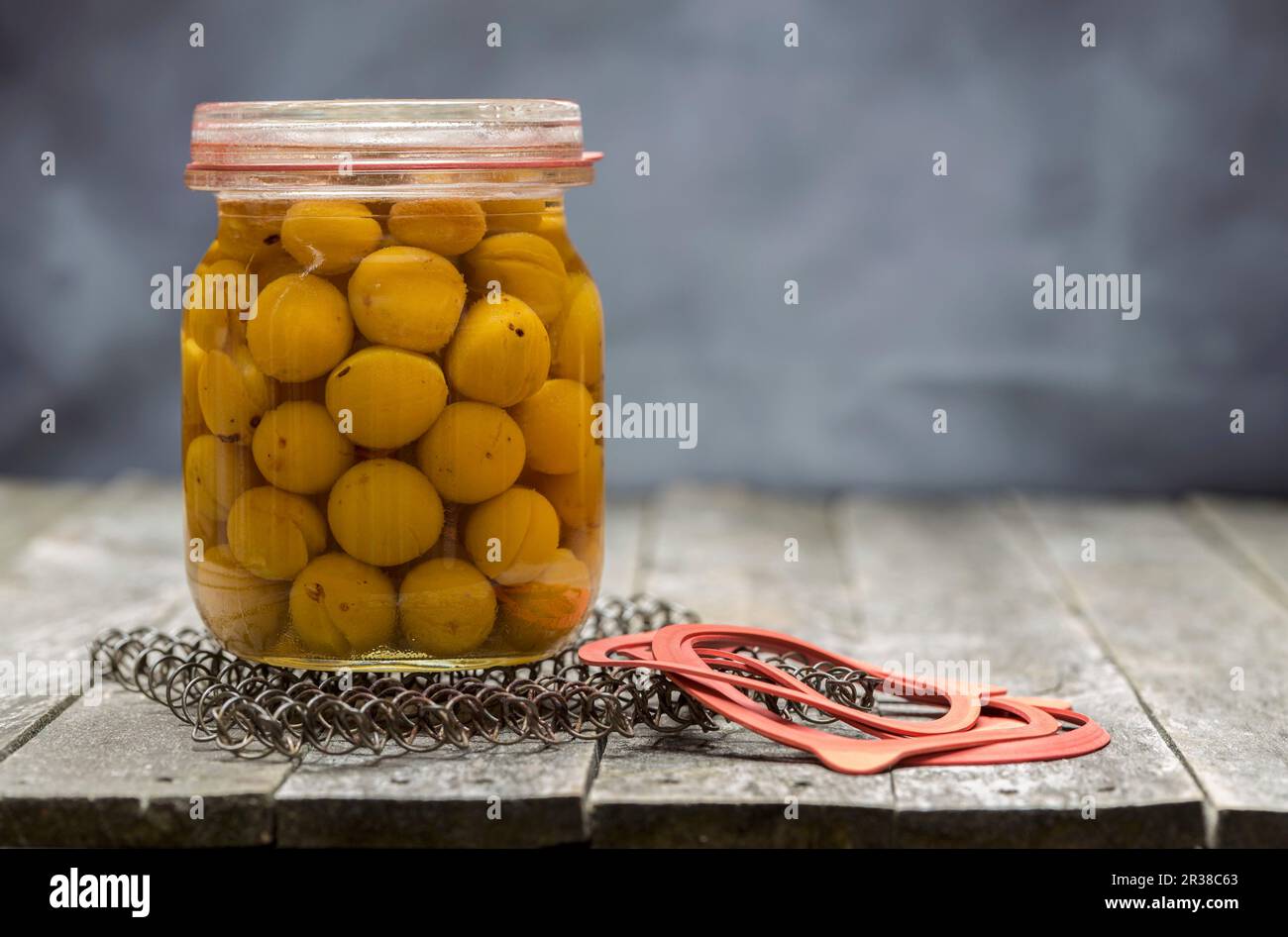 Preserved small yellow plums in a glass jar Stock Photo Alamy