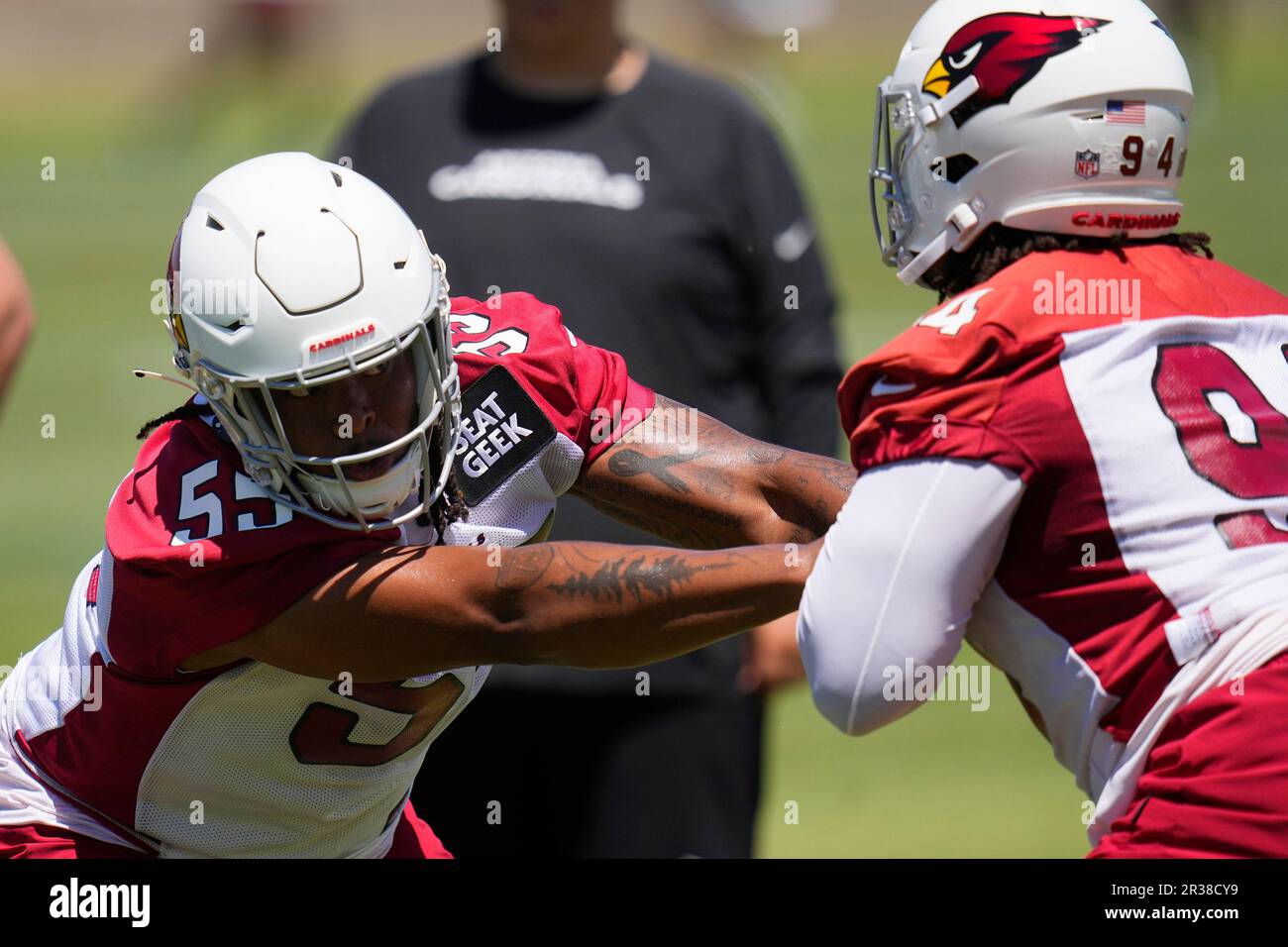 Arizona Cardinals defensive linemen Dante Stills (55) and Carlos Watkins (94) work on pass rushing drills during OTA workouts at the NFL football team's training facility Monday, May 22, 2023, in Tempe, Ariz. (AP Photo/Ross D. Franklin) Stock Photo