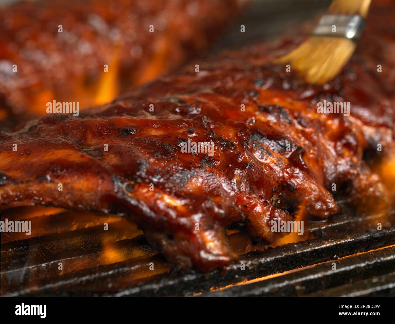 Brushing meat on barbecue hi-res stock photography and images - Alamy