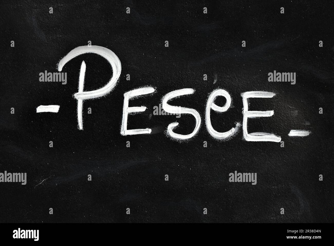 White chalk PESCE word over black chalkboard Stock Photo