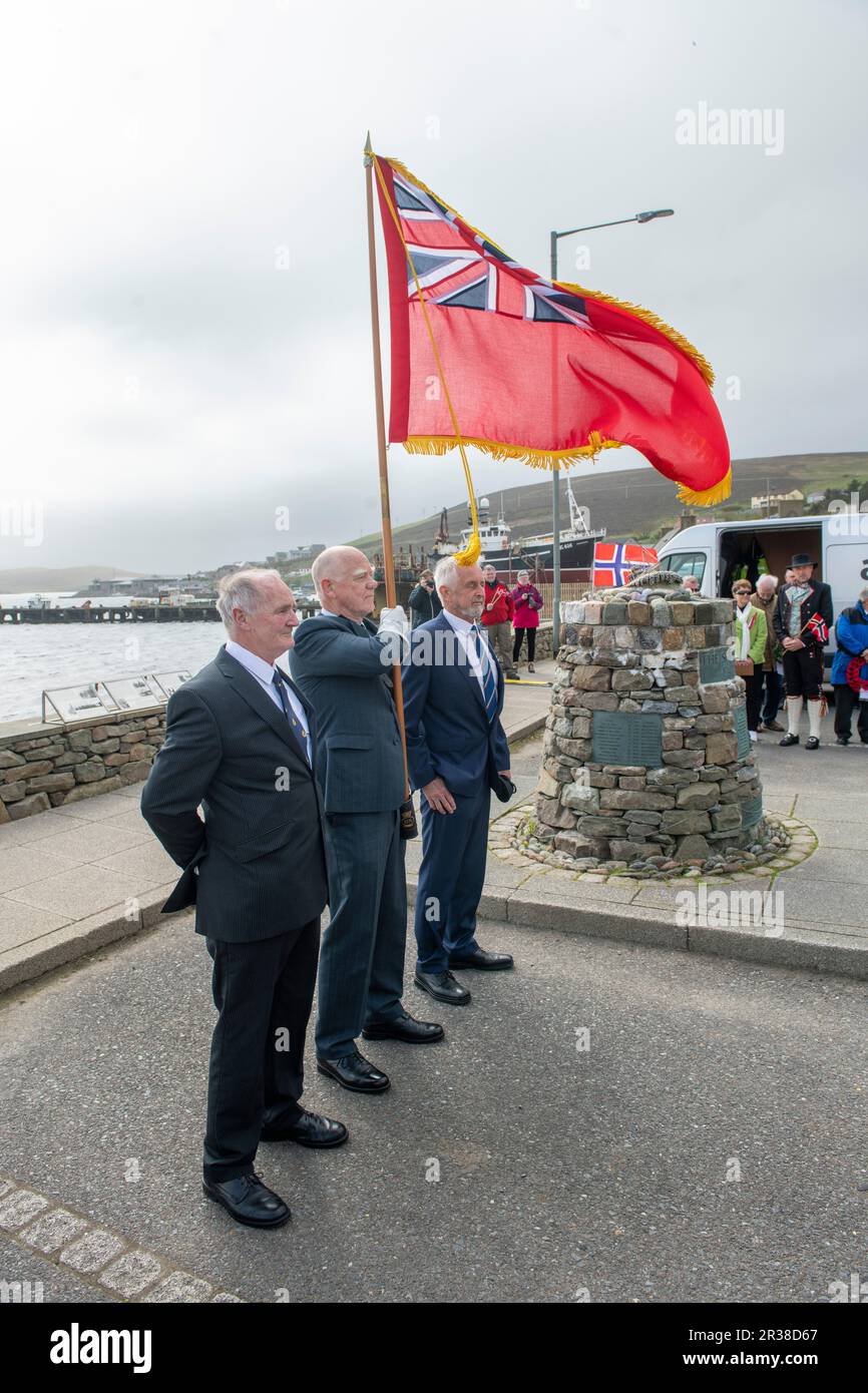 Norwegian day being celebrated in the Shetland village of Scalloway at the Shetland Bus memorial in the village on the westside of the islands. Stock Photo