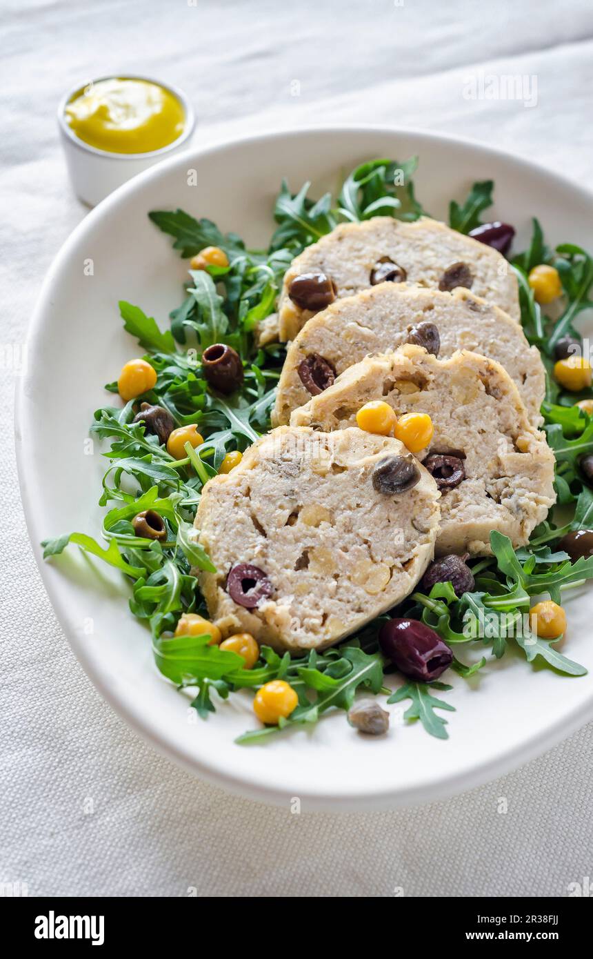 Tuna fish meat loaf with rocket, chickpeas and olives Stock Photo - Alamy