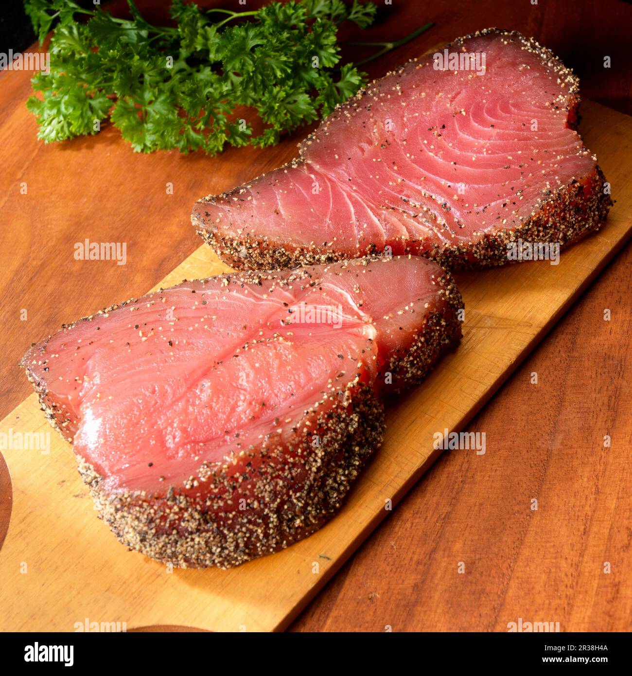 Two tuna steaks with black pepper coating Stock Photo Alamy