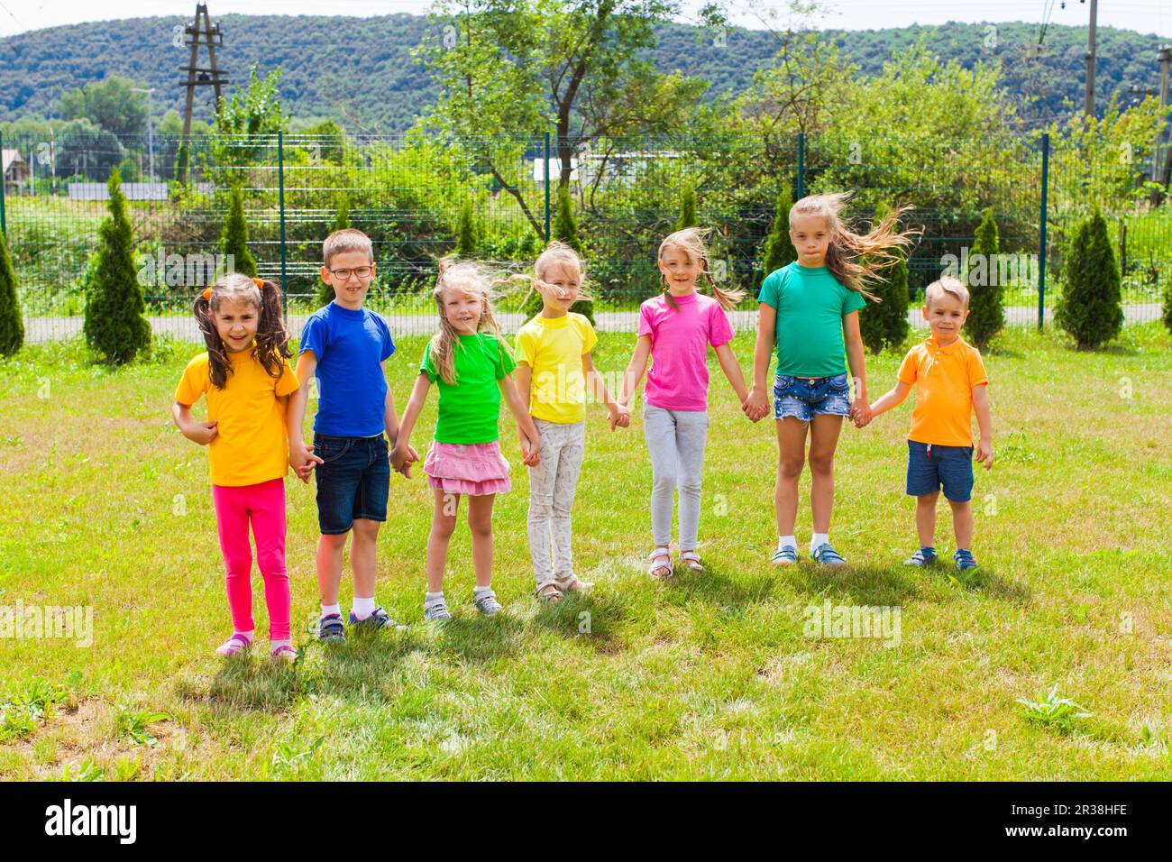 Happy cheerful kids in colorful t-shirts Stock Photo - Alamy