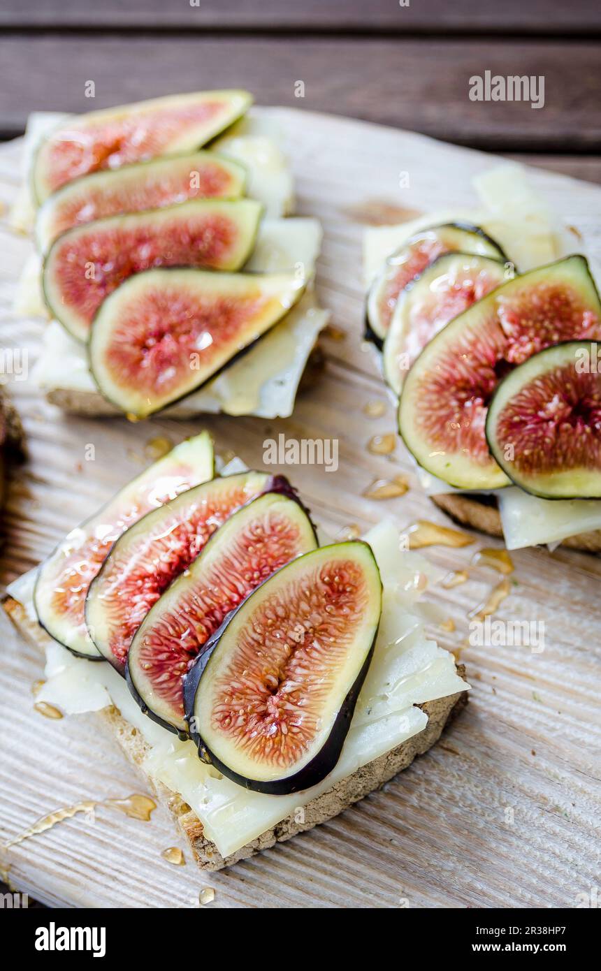 Bruschetta toasted sliced sourdough bread with cheese and figs drizzled