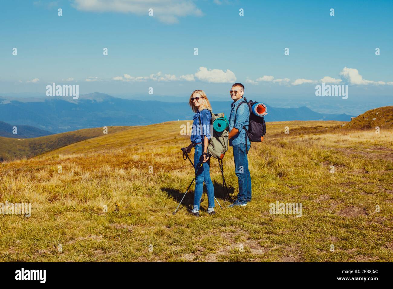 Happy man woman hiking mountains hi-res stock photography and images ...