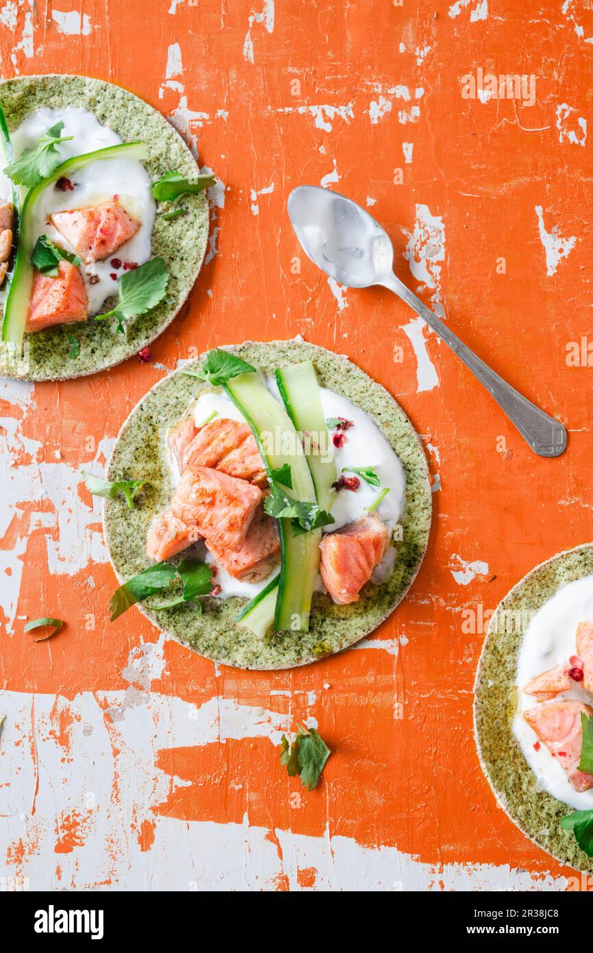 Algae tacos with salmon and cucumber strips Stock Photo