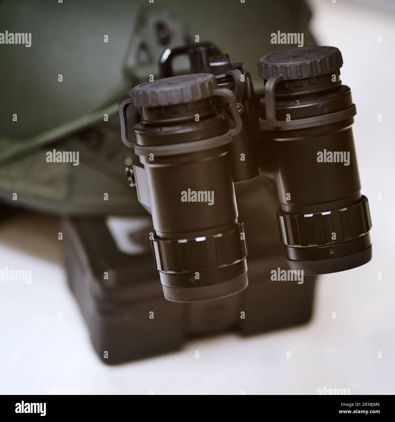 Army binoculars with night vision on a soldier's helmet. Optical device on a military helmet for