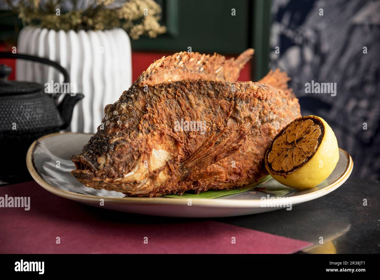 Filipino style whole fried Tilapia fish Stock Photo Alamy