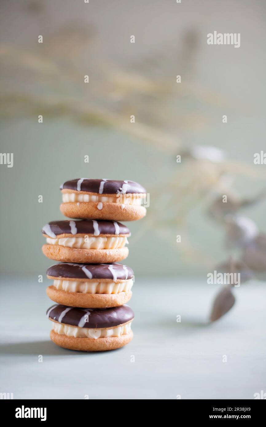 Sandwich cookies with chocolate icing Stock Photo