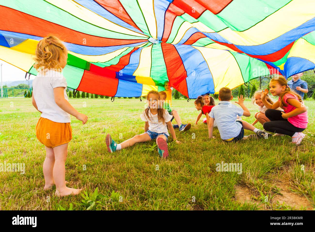 Funny games under colorful canopy in the summer outdoors Stock Photo