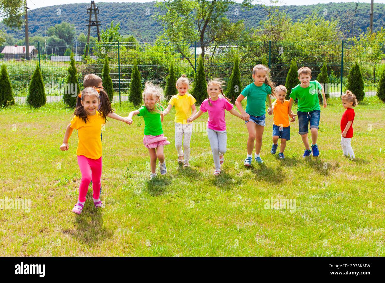 Runnig children at summer camp in the summer outdoors Stock Photo
